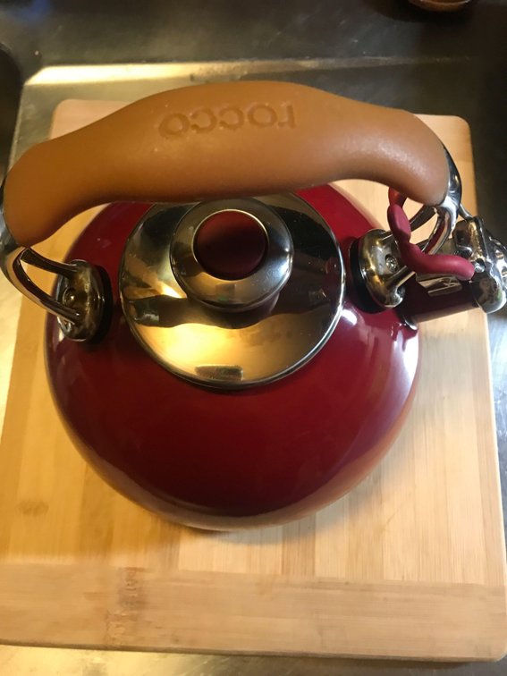 tea kettle with 2 cutting boards