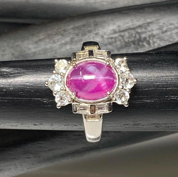 Sterling Silver 925 3.45ctw Oval Cabochon Synthetic Pink Star Sapphire with 1.21ctw White Topaz
