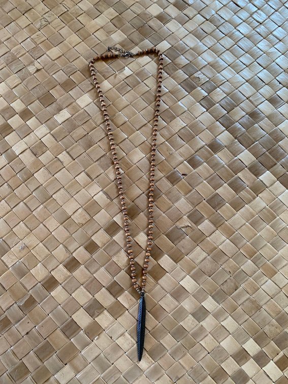 Long necklace with elngated pendant