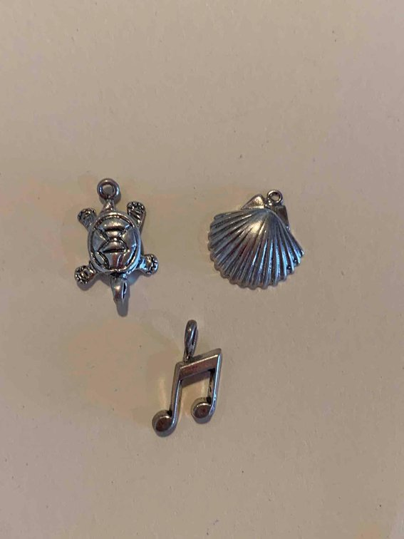 Three small charms