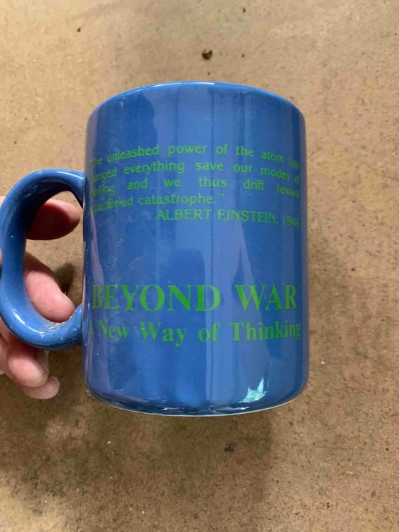 Six "Beyond War" mugs