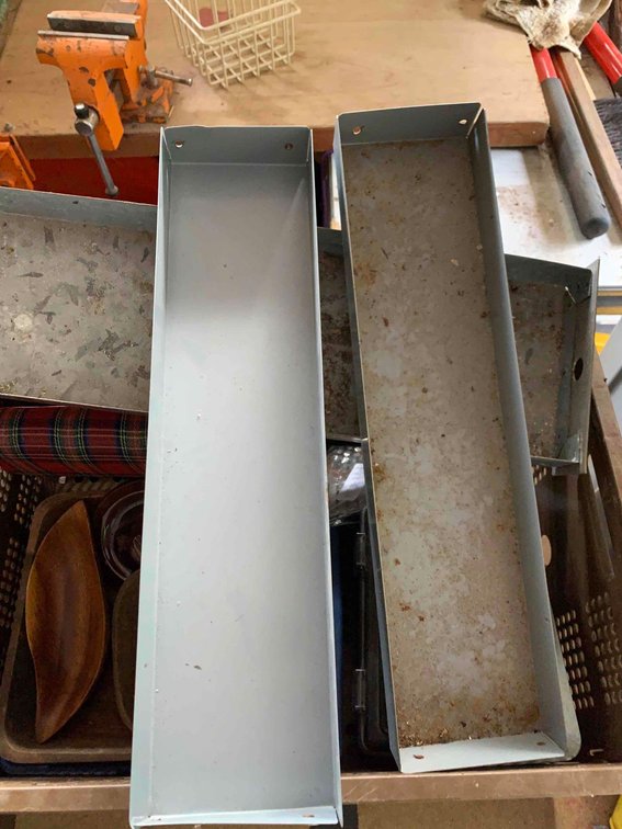 Three metal trays and wire rack for workshop organization