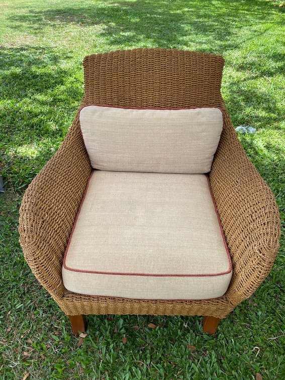 Woven Island Style Arm Chair with Cream Colored Cushions