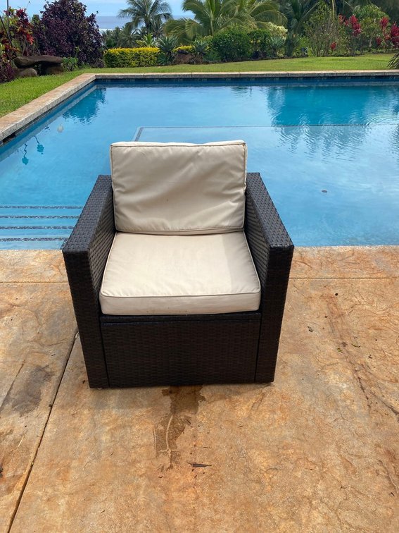 Outdoor Patio Arm Chair with Light Colored Cushions 