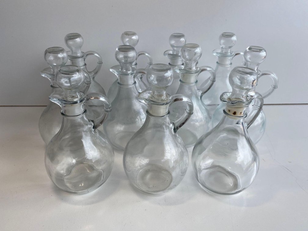 Set of 11 Oil/Vinegar Pitchers 