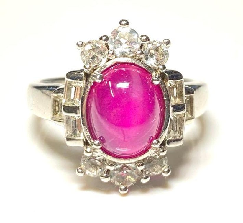 Sterling Silver 925 3.45ctw Oval Cabochon Synthetic Pink Star Sapphire with 1.21ctw White Topaz