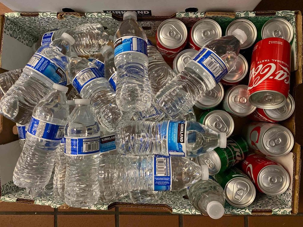 Mixed Cans of Soda and Kirkland Bottled Water 