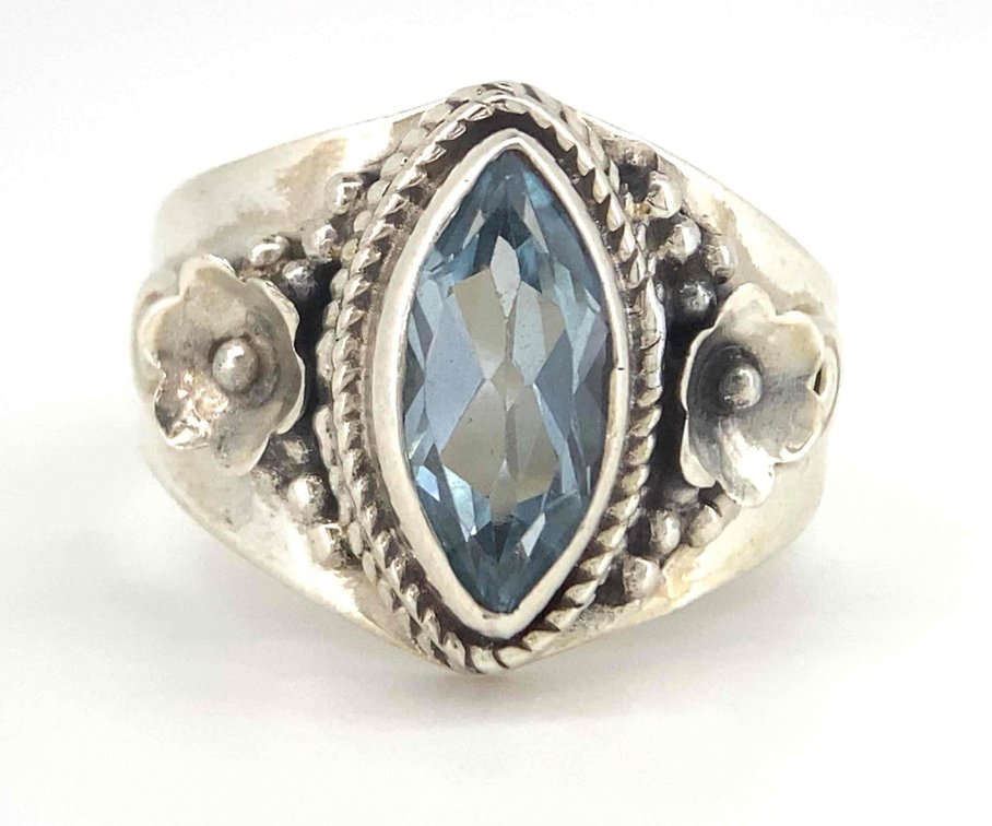 Genuine Blue Topaz Marquise Cut With Silver Flower Accents  4.67 Grams  Size 8