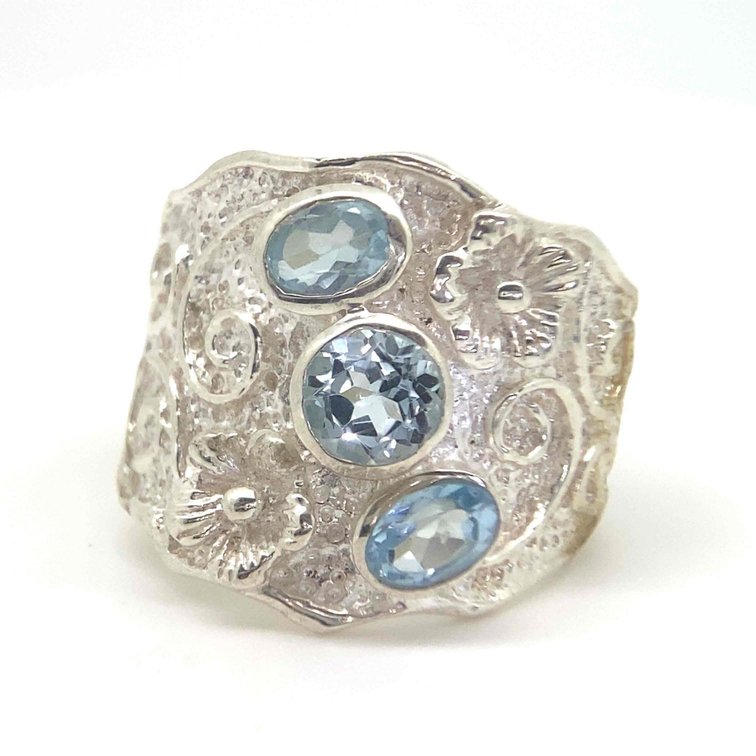 3 GENUINE BLUE TOPAZ WITH PLUMERIA DESIGN SIZE 10   9.1 GRAMS