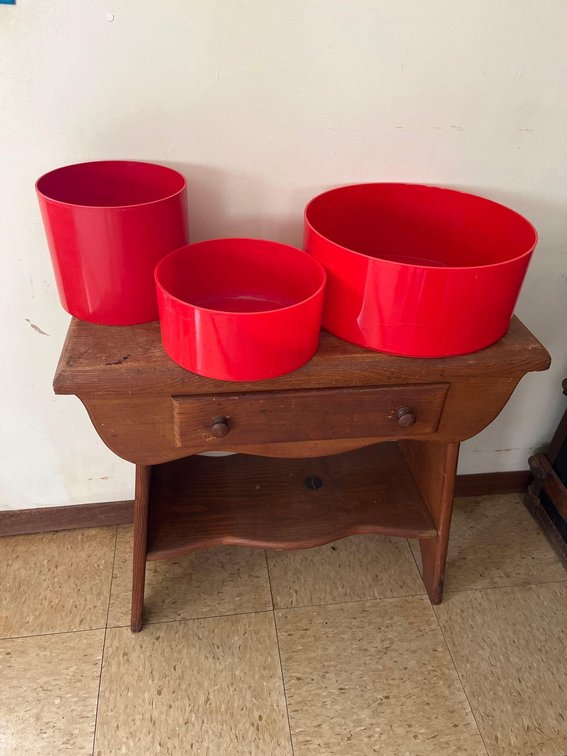 Red plastic crate and barrel decorative bowls