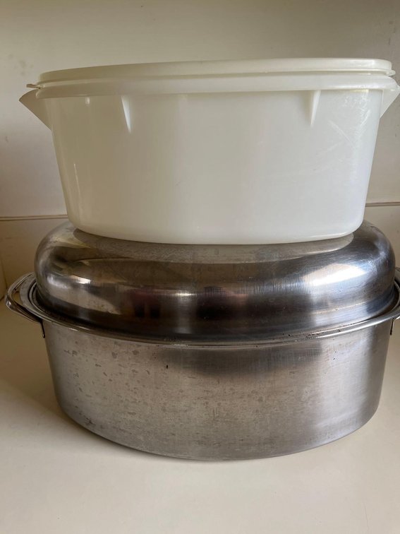stainless steel roasting pan with Tupperware storage. Great for roasting turkeys or a ham