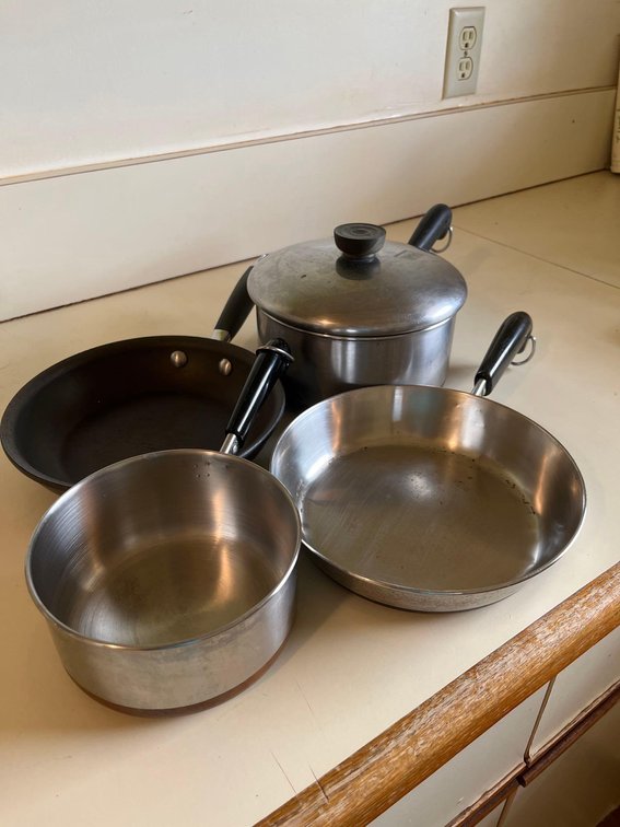 assorted revere pans and Anolon small pan