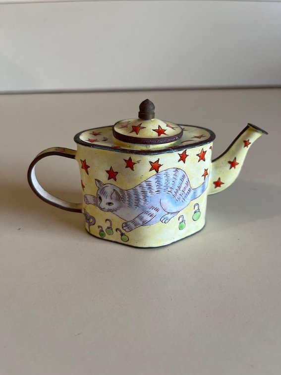 yellow cat, ceramic pitcher