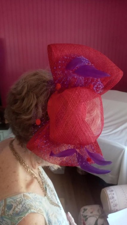 (X's 2) Clip on hat; visor style cap w/red feathers; purple hat w/feathers; large purple feather 