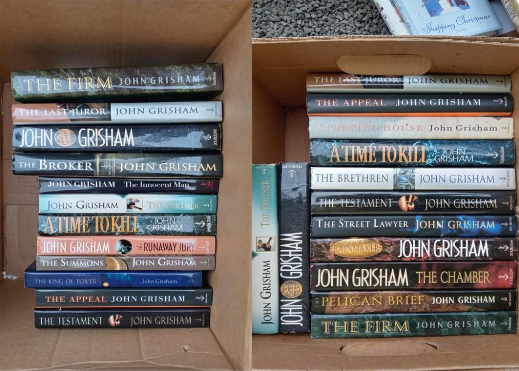 Two (2) boxes of John Grisham Books