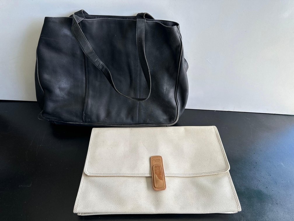 Black Purse and White Folded Clutch Purse 