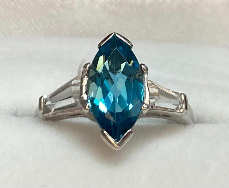 14K Fine Gold with 1.5 Carat Blue Topaz and Clear Baguettes  3.0 Grams  Size 5.25