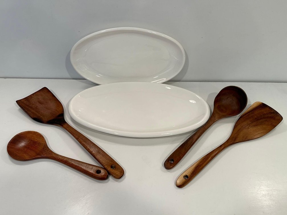 White Oval Serving Plates and Wooden Serving Utensils 