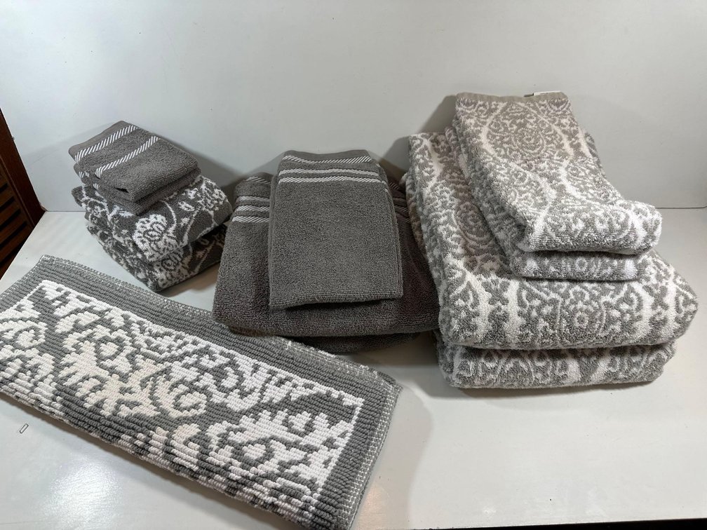 Gray and White Bath Towels and Rug 