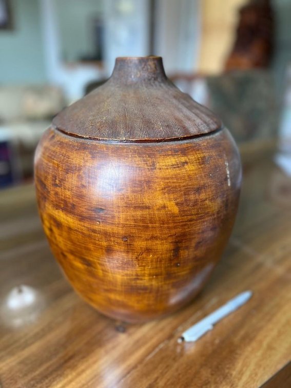 Round carved wooden vase