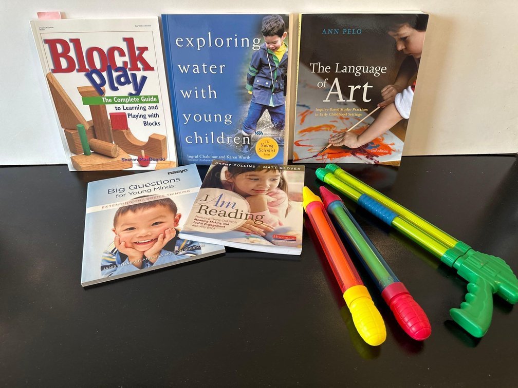 Mixed Lot of Parenting Help Books and Water Guns