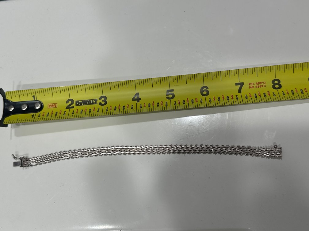 Silver bracelet with safety clasp