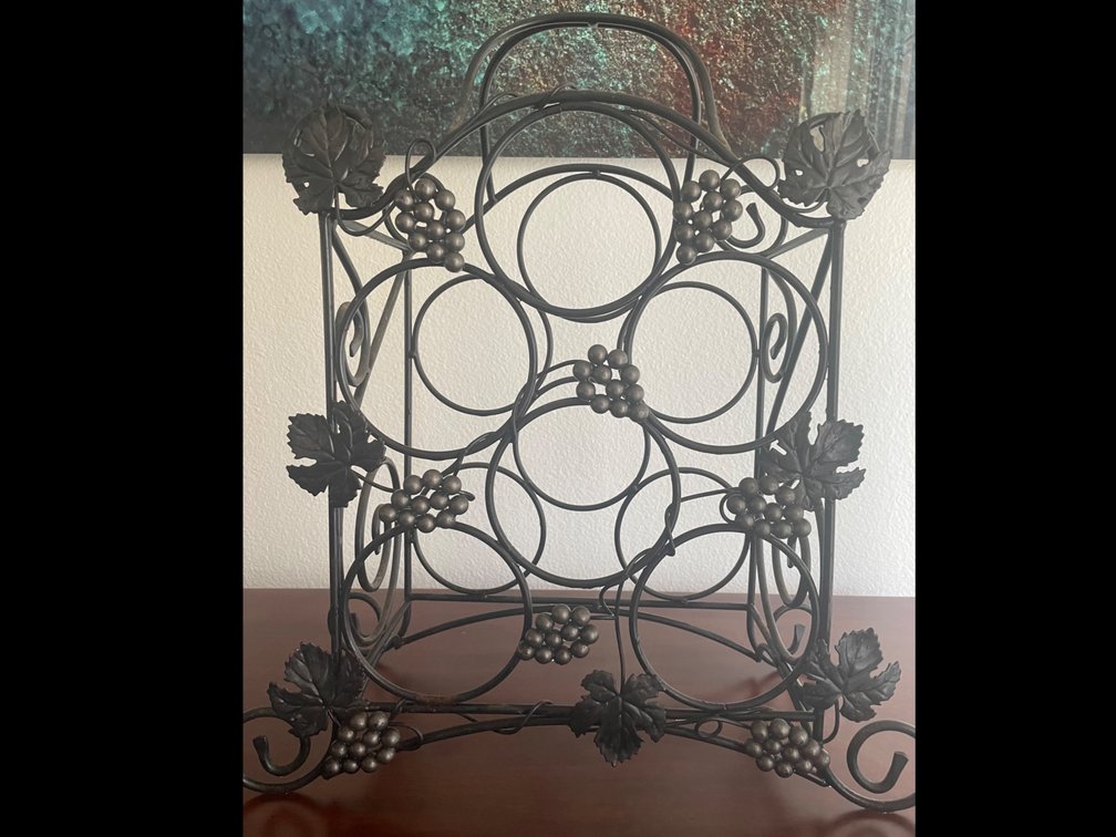 Black metal antique wine bottle holder