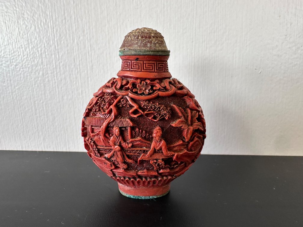 Intricately Carved Cinnabar Snuff Bottle