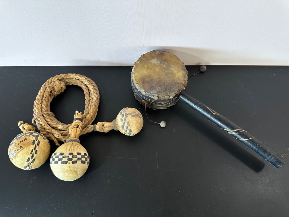 Set of Global Trinkets – Traditional Argentina Bola and Handheld Pellet Drum