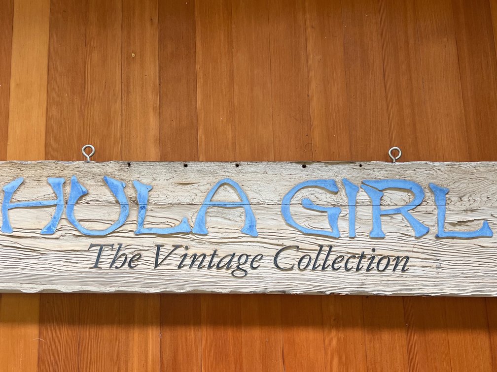 Wood sign from old Aloha shirt shop Kapaa