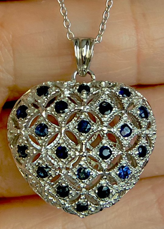 Nearly 1 Carat of Beautiful Blue Sapphires set in a Substantial Heart Shaped Pendant with Matching Chain  7.21 Grams