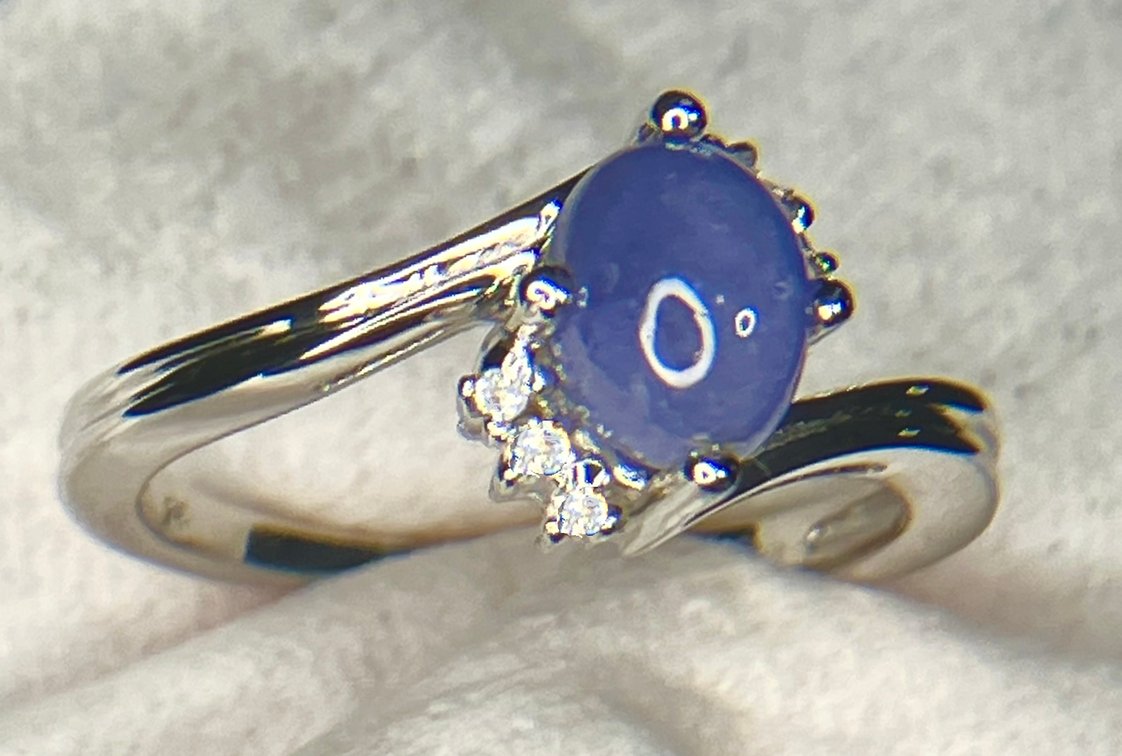 NEW Cabochon Tanzanite with White Topaz Accent Gemstones Set in a Fine Rhodium Over Sterling Ring Mounting. 