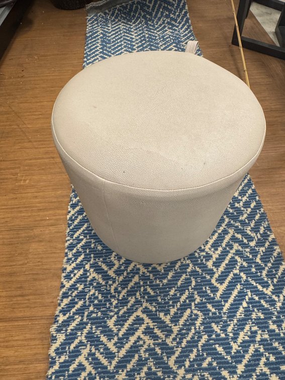Faux leather rolling ottoman