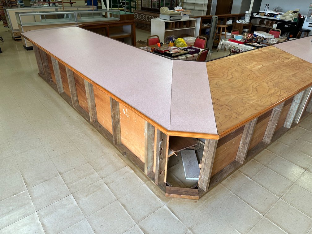 Large U-Shaped Retail Counter with Storage Shelving