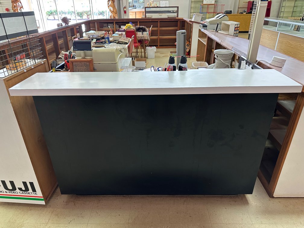 Retail Counter with Two-Level Countertop and Storage Shelves
