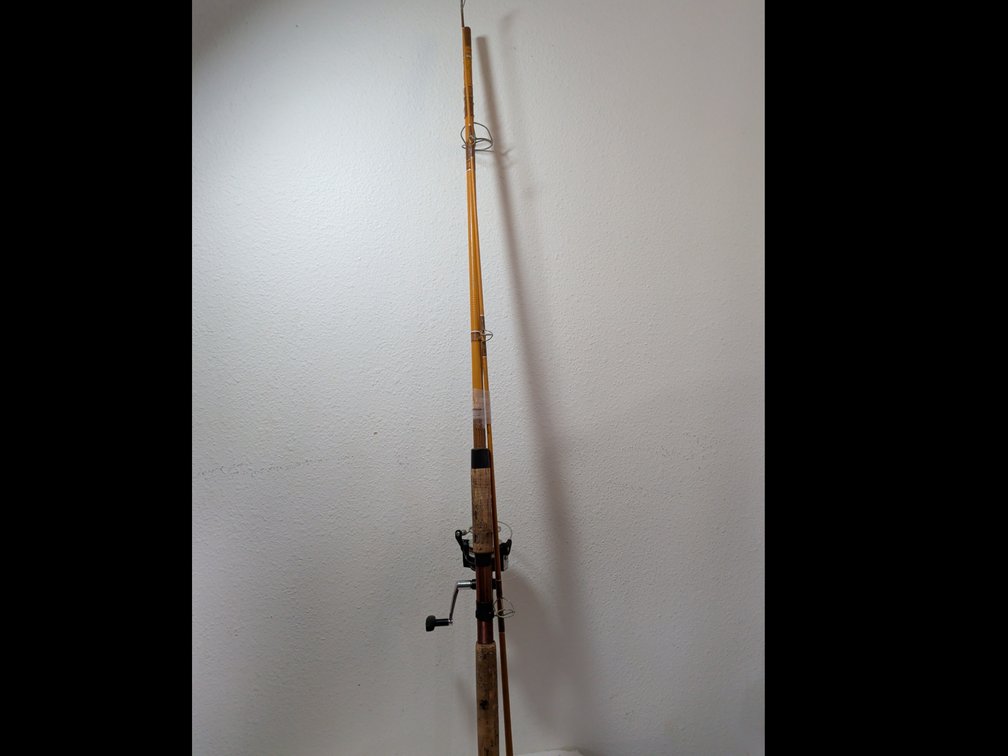 8' Brown Daiwa Fishing pole and daiwa J-16 reel.  