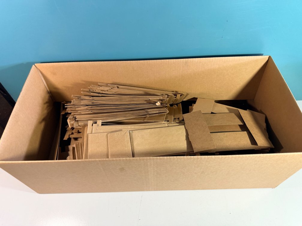 Box of Flat Brown Paper Bags and Carboard Trays