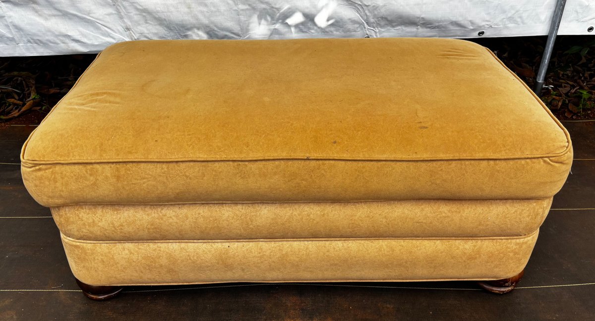 Golden Tan Upholstered Ottoman With Wooden Feet