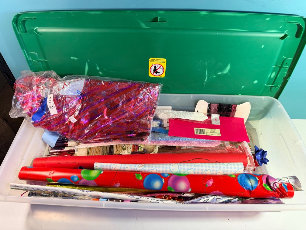 Plastic Storage Bin with Lid and Gift Wrap Contents