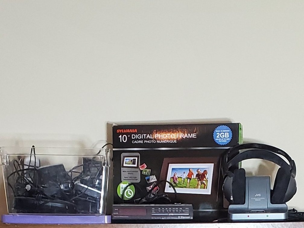 Sylvania 10" Digital Photo Frame, Emerson AM/FM Clock Radio, JVC Cordless Headphones & more. (LPO)