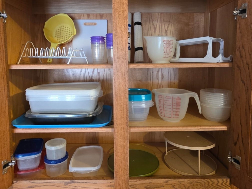 Assorted Plasticware Including Colander, Cutting Board, Storage Containers & More