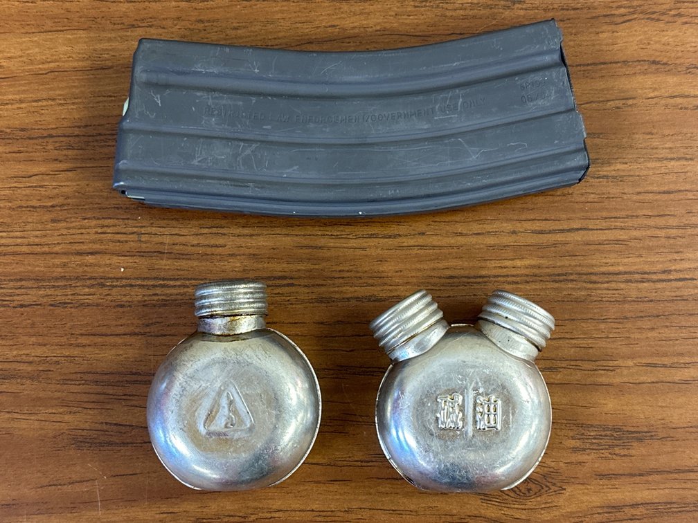 (2) SKS Oil Bottles & Daewoo K2 Magazine.