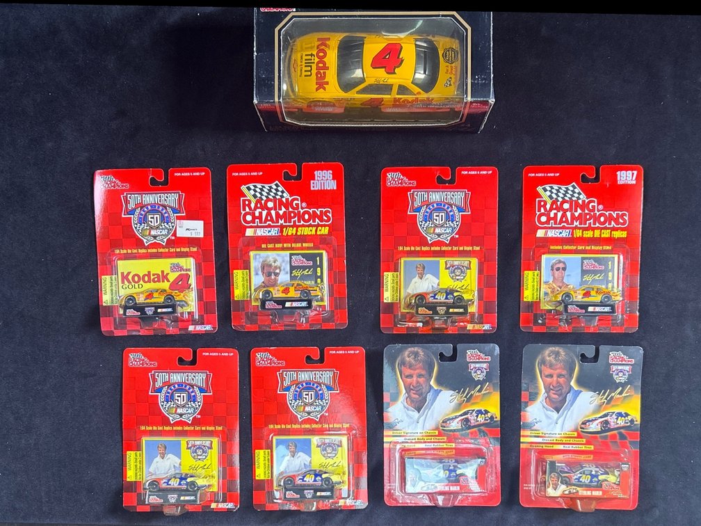 (8) 1/64 Scale Sterling Martin Die Cast Cars.