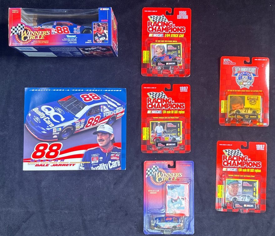  (1) 1/24 Scale (3) 1/64 Scale Dale Jarret Die Cast Cars And (2) 1/64 Scale Steve Grissom Die Cast Cars.