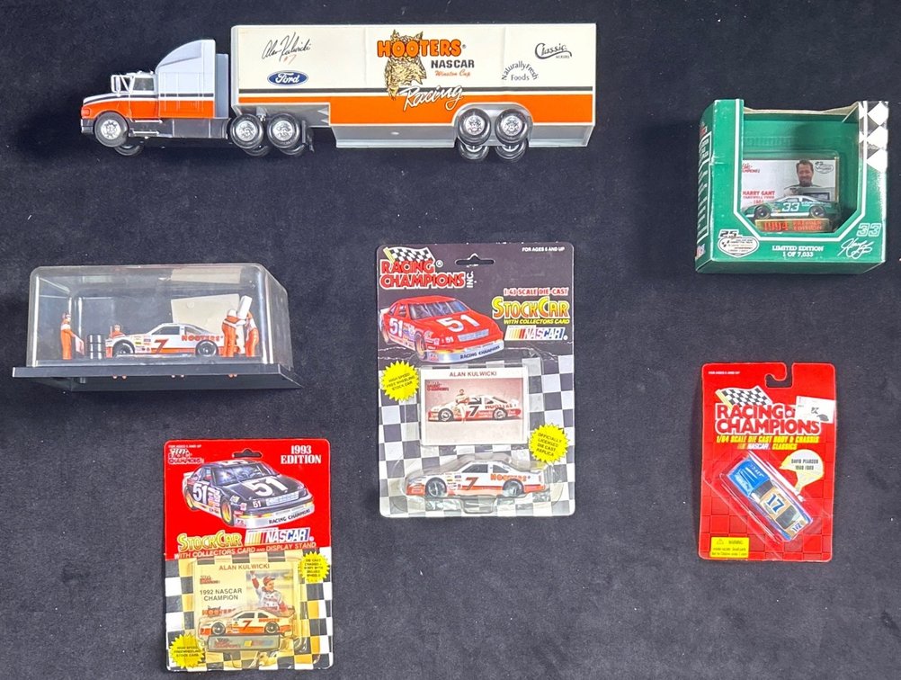 (2) 1/64 Scale Alan Kulwicki Die Cast Cars, Car Hauler, And More.