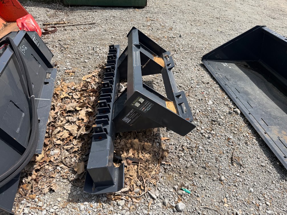 Skid steer ripper/rake
