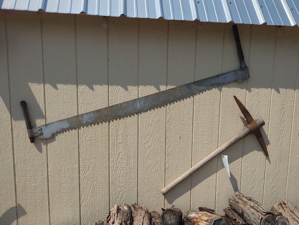 (3) Saws, Pick Ax and Ax on Shed