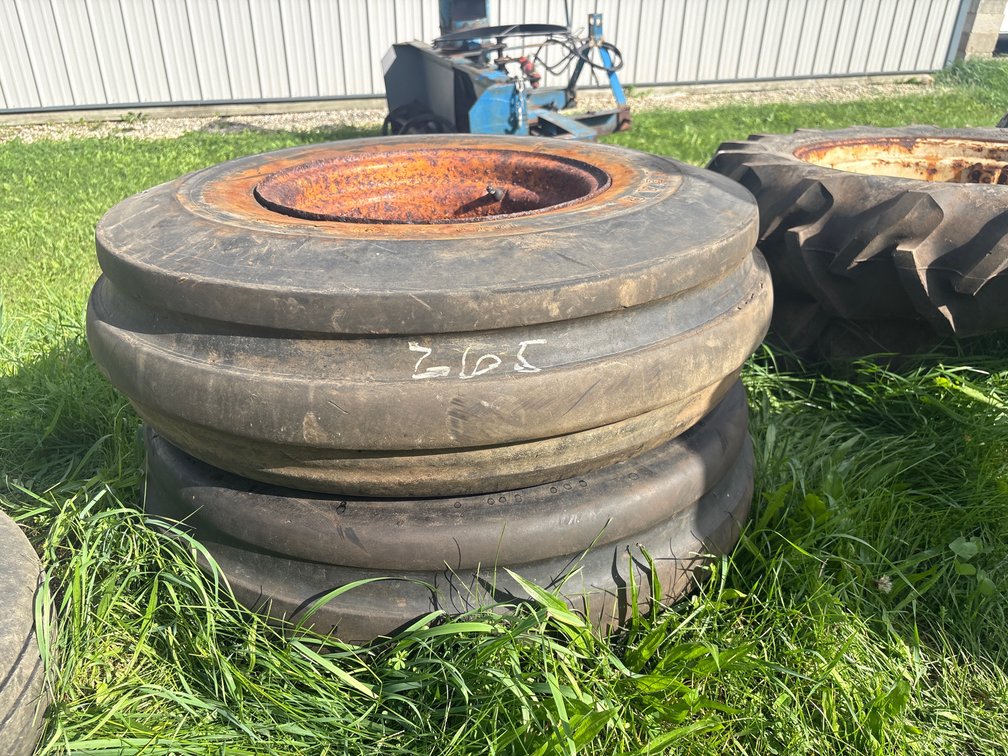 (2) 8 bolt 16 inch implement rims w/ 10.00-16 tires