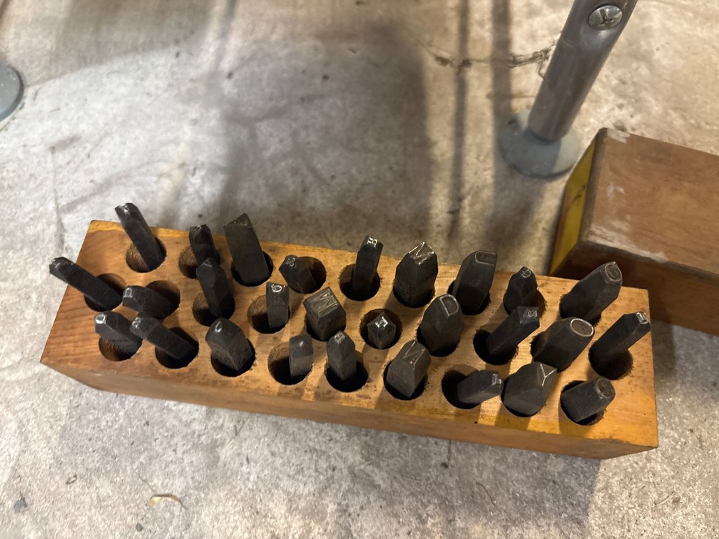 Metal punches, assorted sized letters