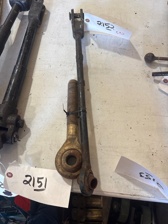 Top link and loft arm